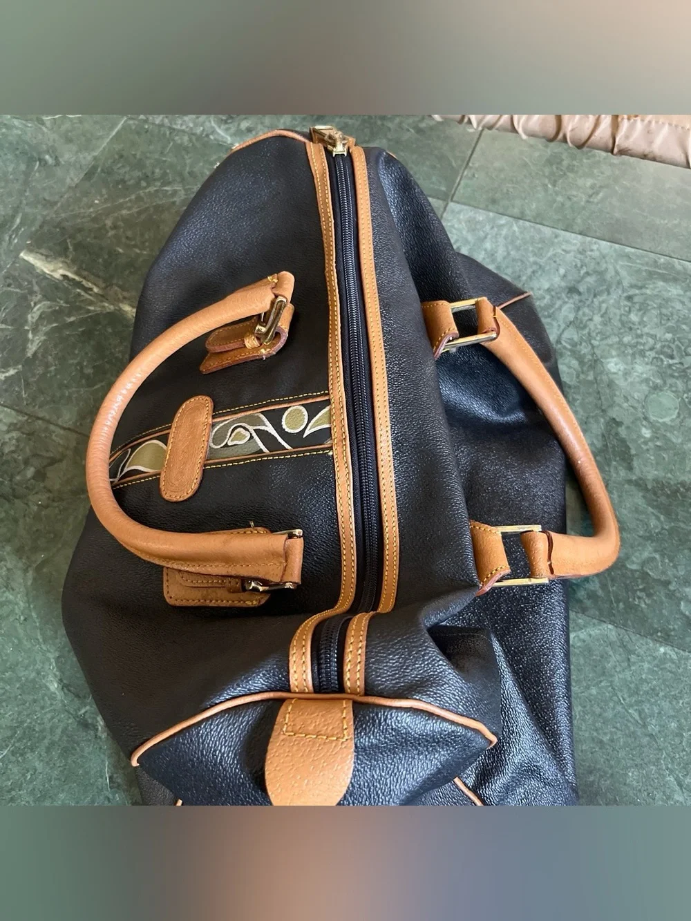 Black Leather Duffel Bag with Brown Trim and Olive Pattern Accent